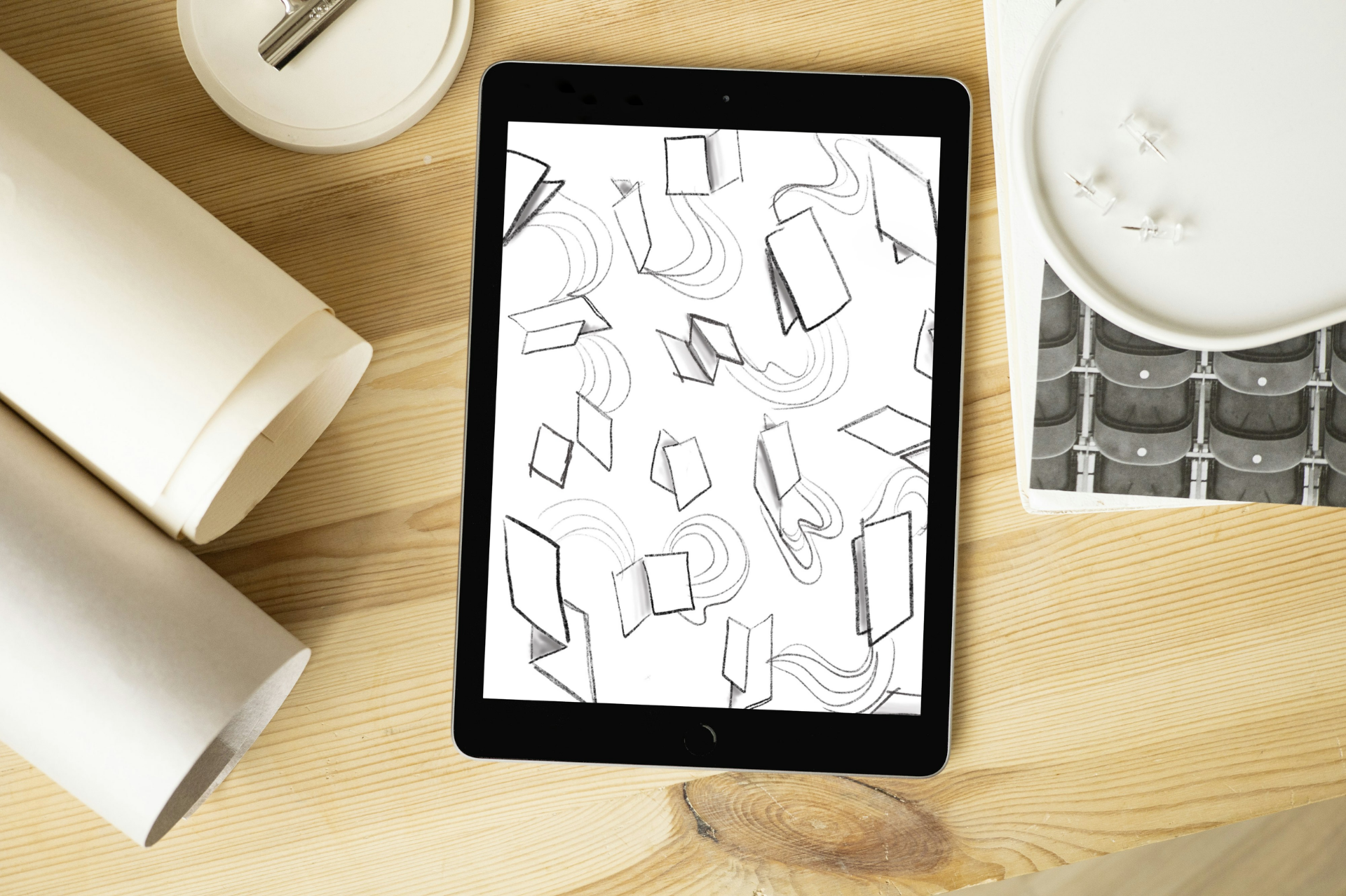 Concept sketches on tablet exploring shapes and motion